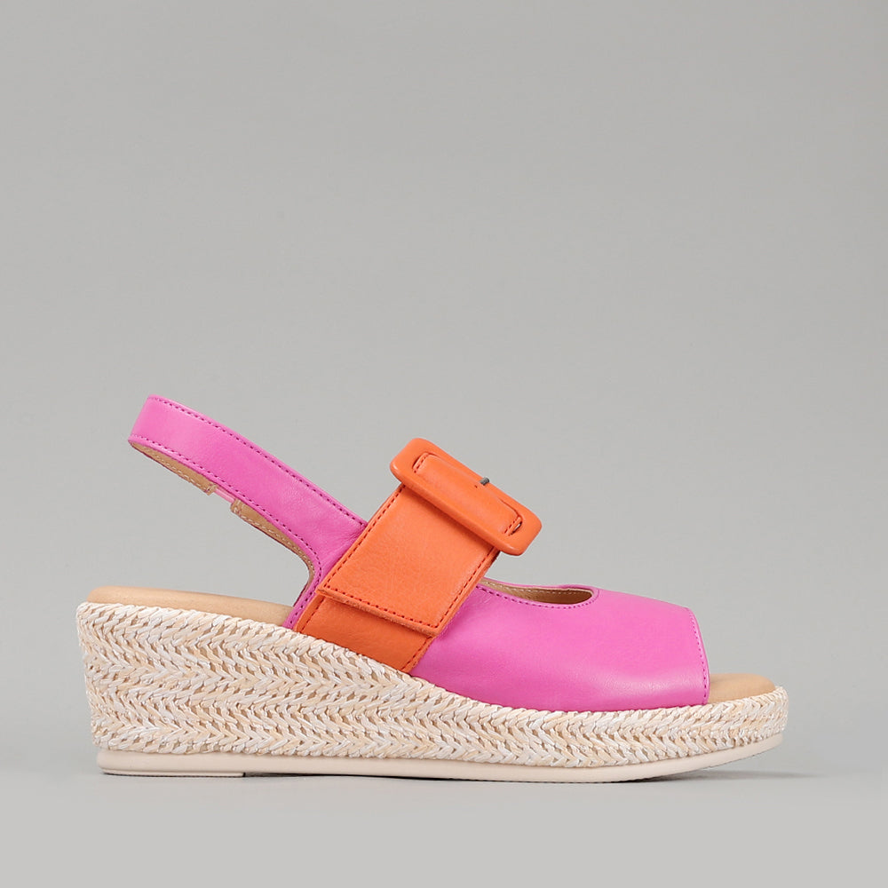 Le Sansa Parola Fuchsia Orange sandals with open toes and ankle straps, vibrant color block design on a neutral background.