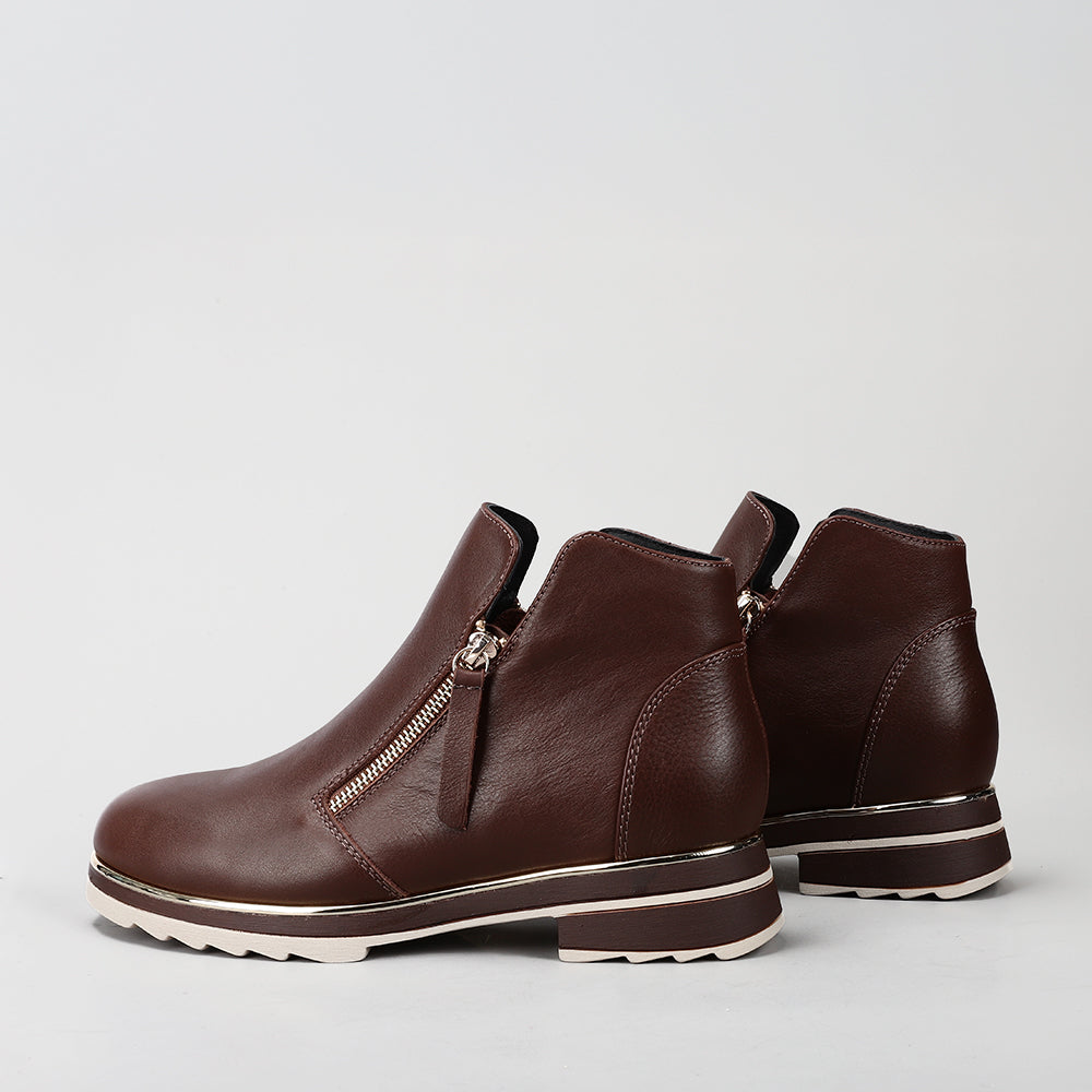 Le Sansa Basel Chocolate boots showing brown leather material, ankle height, and stylish design with laces.