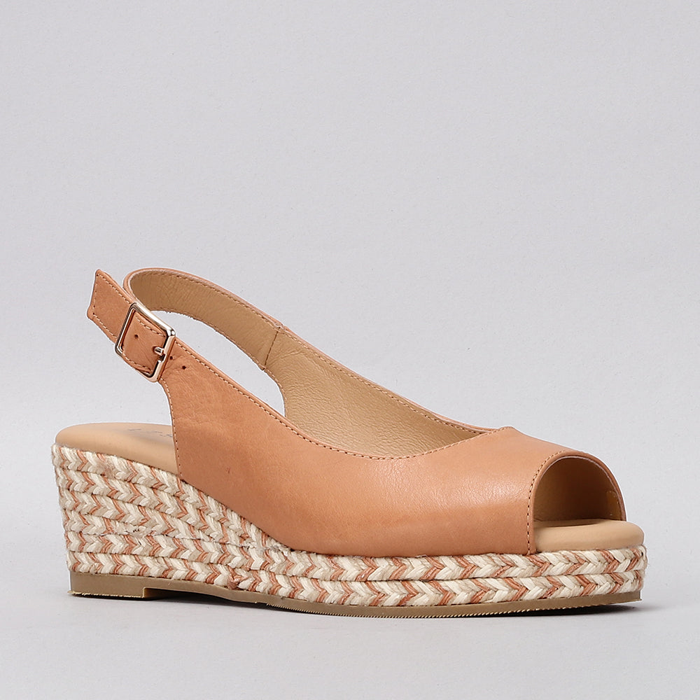 Le Sansa Dove Tan sandals featuring tan leather straps and flat sole, stylish and comfortable for casual wear.