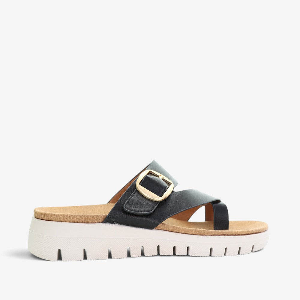 Black slip-on shoes from CC Resorts with a sleek, minimalist design suitable for casual and resort wear.