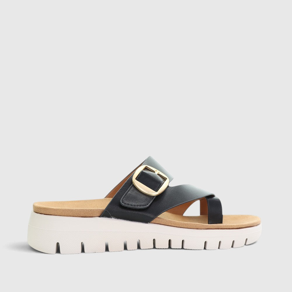 Black CC Resorts Domino slip-on shoes with sleek design and comfortable fit, shown on a plain background.