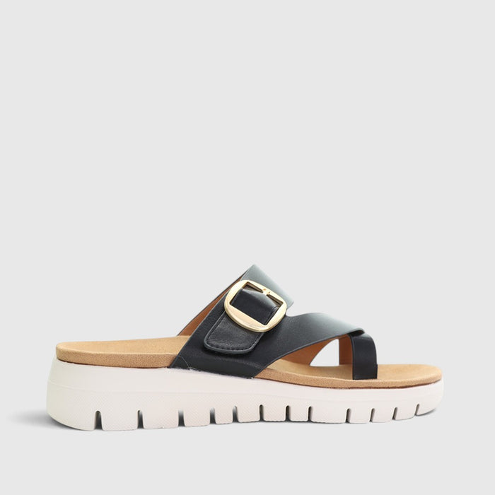 Black CC Resorts Domino slip-on shoes with sleek design and comfortable fit, shown on a plain background.