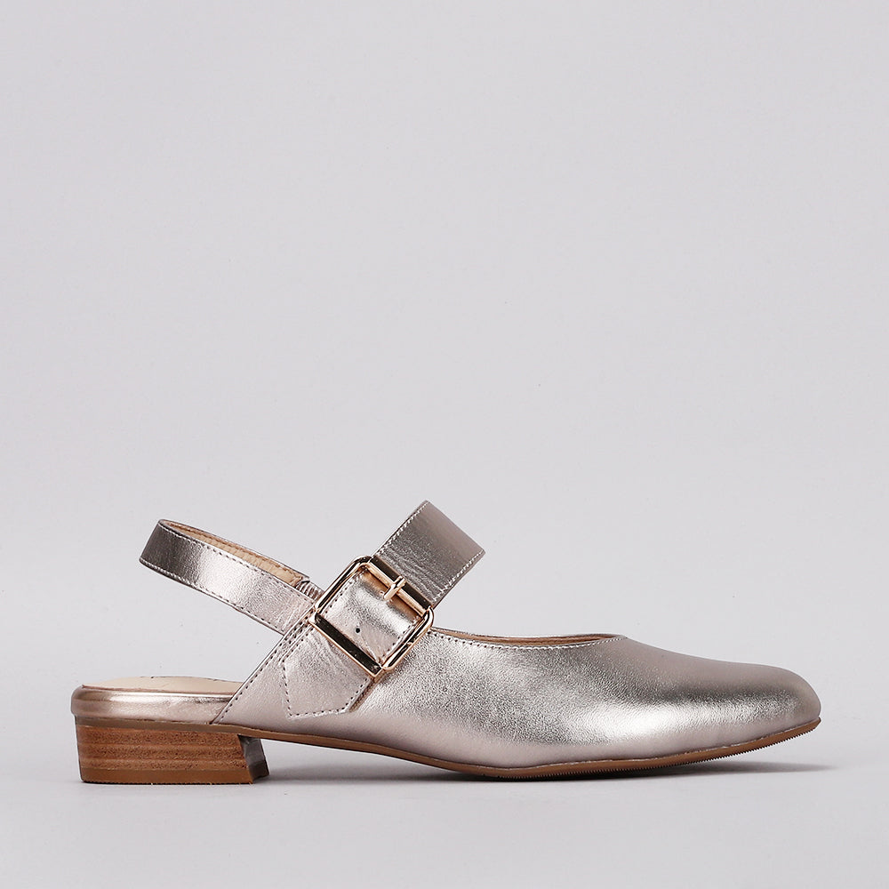 Naked Arches Yoko Champagne sandals with strappy design and flat sole, featuring a champagne-colored finish and minimalist style.