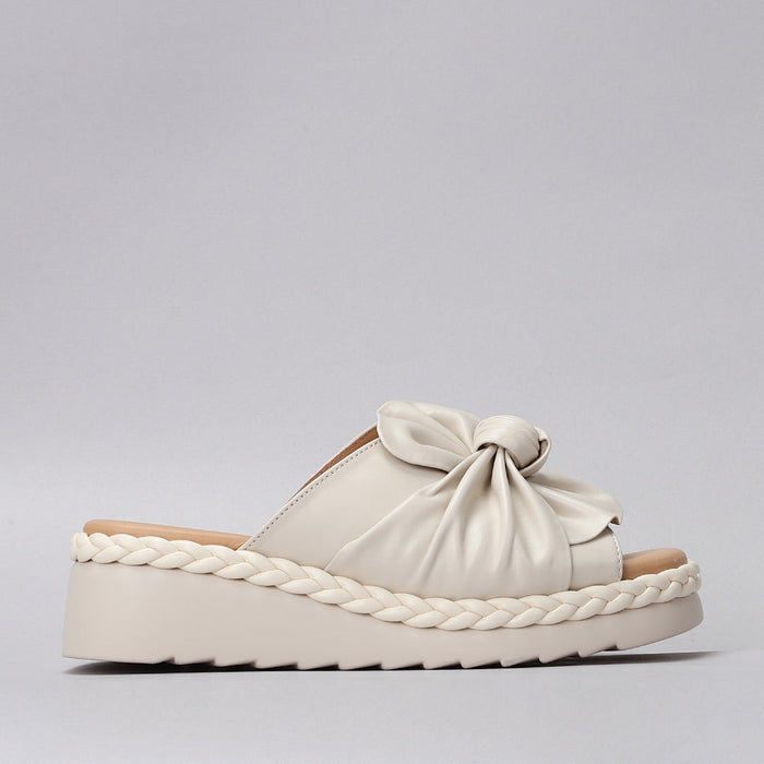 Le Sansa Sansa Eudore Cream slip-on shoes in soft fabric with stylish design and neutral color.