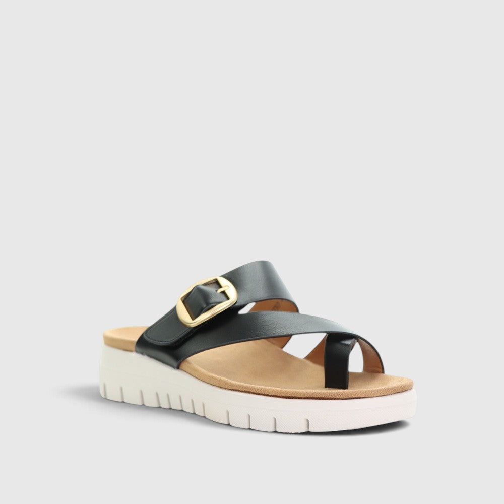 Black CC Resorts slip-on shoes from the CC Resorts Domino collection, featuring a sleek, casual design and comfortable fit.