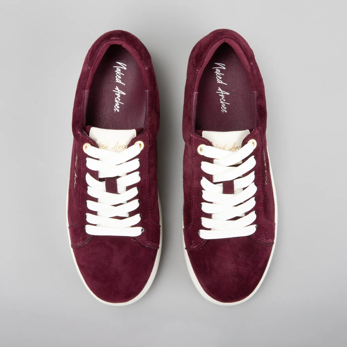 Naked Arches Azealia Burgundy sneakers with stylish design and burgundy color, featuring comfortable laces and athletic sole.