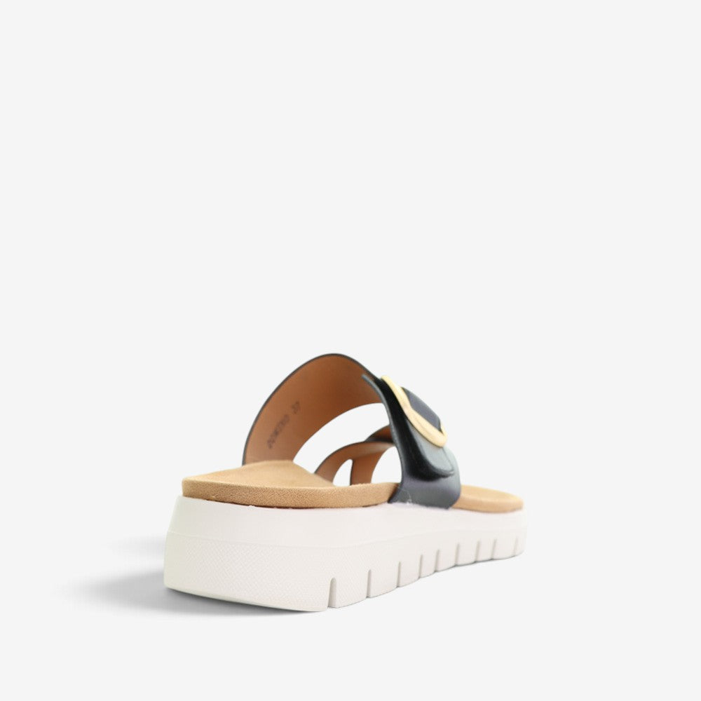 Black CC Resorts Domino slip-on shoes with sleek design and comfortable fit, perfect for casual wear.