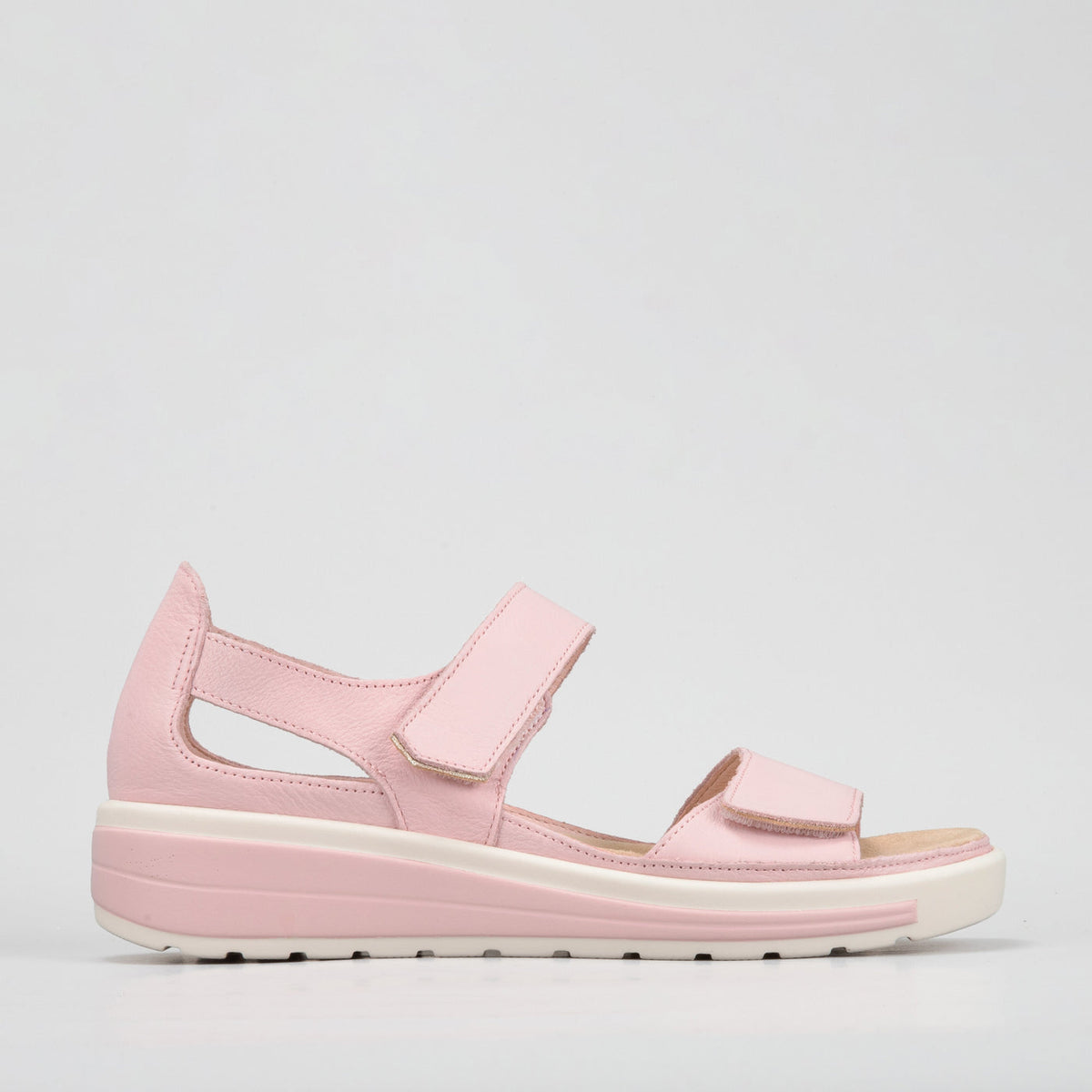 Naked Arches Happy Baby Pink sandals for infants, featuring soft pink straps and comfortable sole, designed for young children's comfort.