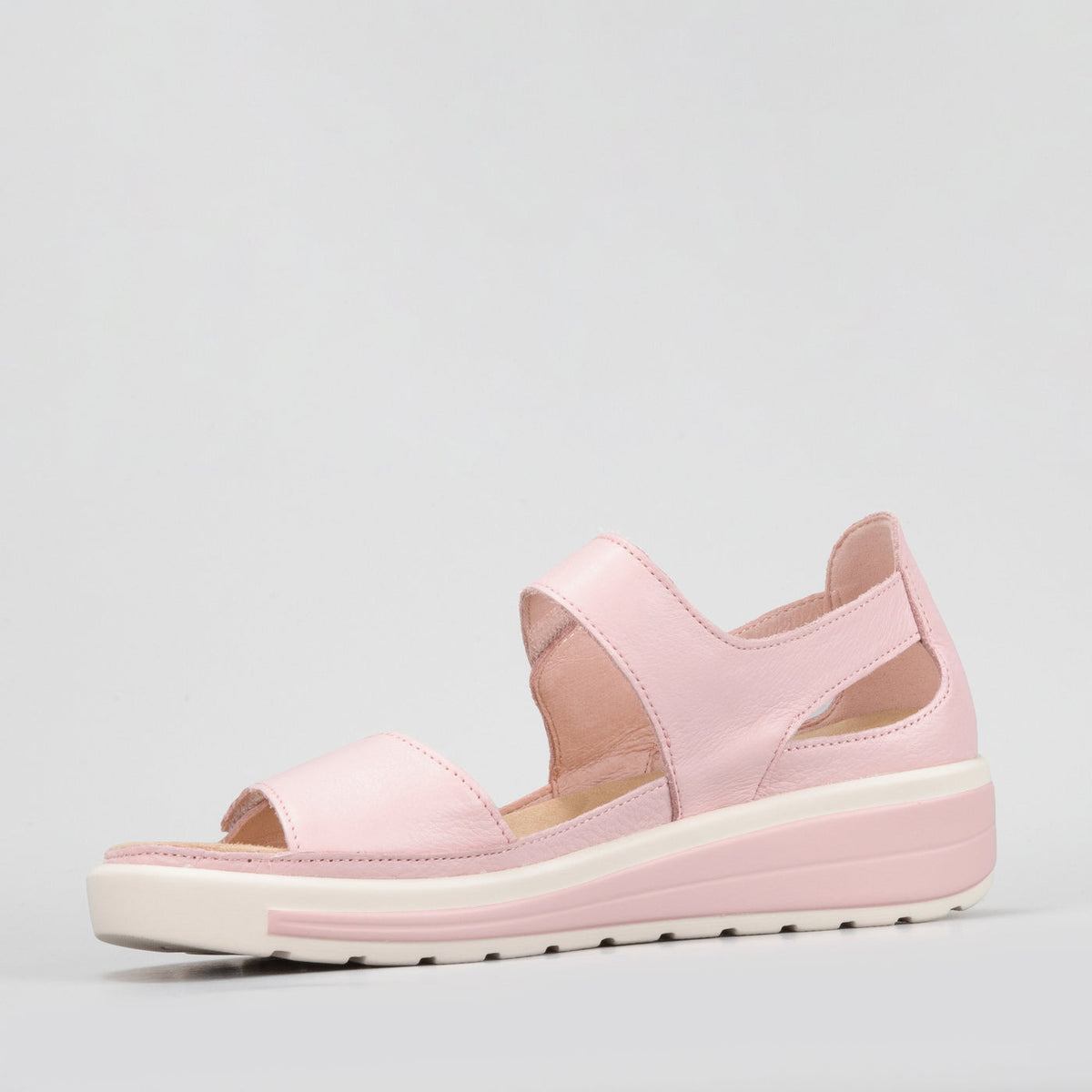 Naked Arches Happy Baby Pink sandals for toddlers, featuring soft pink straps and cushioned soles for comfortable wear.