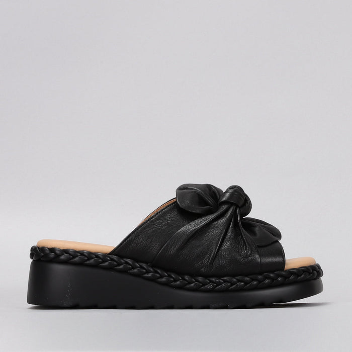 Black Le Sansa slip-on shoes with sleek design and comfortable fit, perfect for casual and everyday wear.