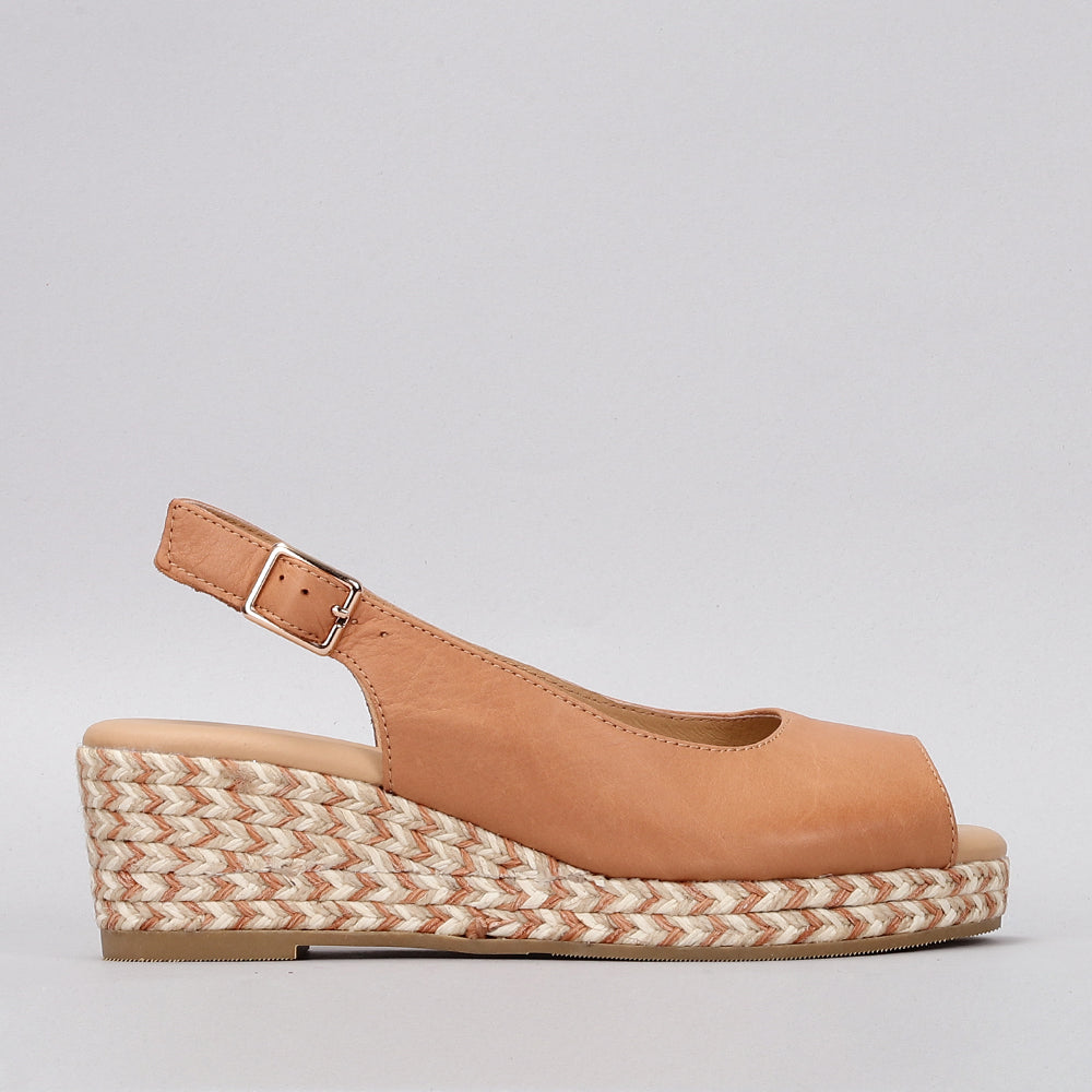 Le Sansa Dove Tan sandals featuring a strappy design and cushioned sole, perfect for casual summer wear.