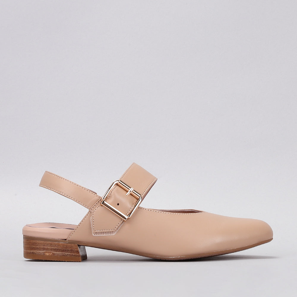 Naked Arches Yoko Sandals with tan leather straps and flat sole, showcasing minimalist design on neutral background.
