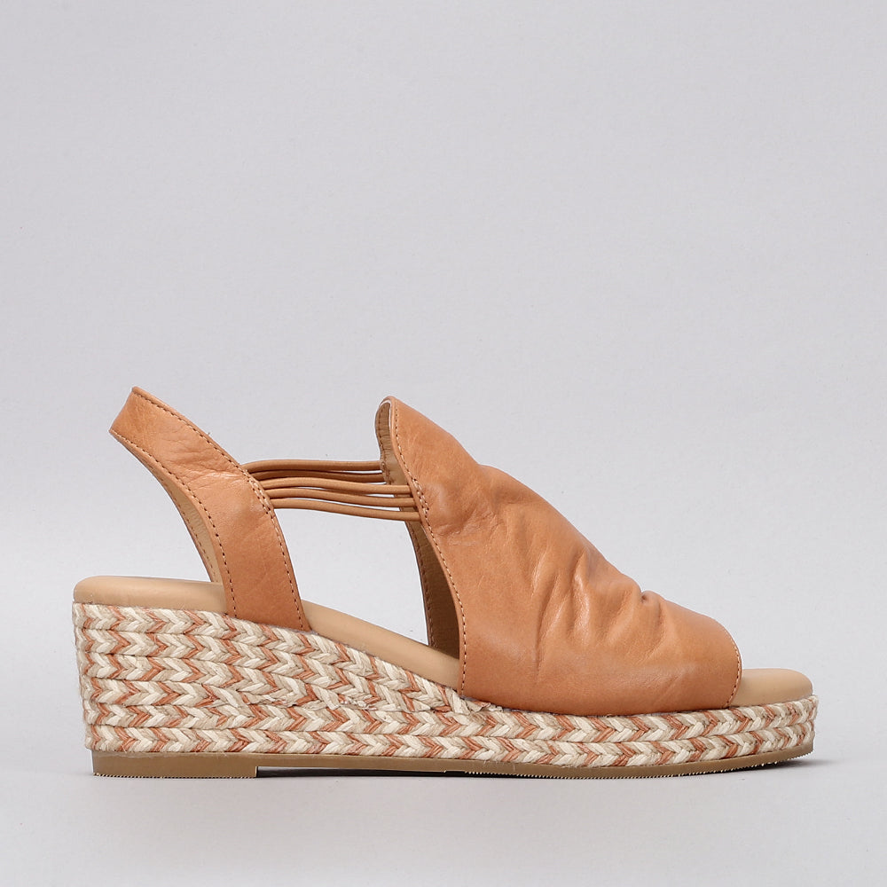 Le Sansa Darla Tan sandals featuring a strappy design and tan leather straps, perfect for casual summer wear.