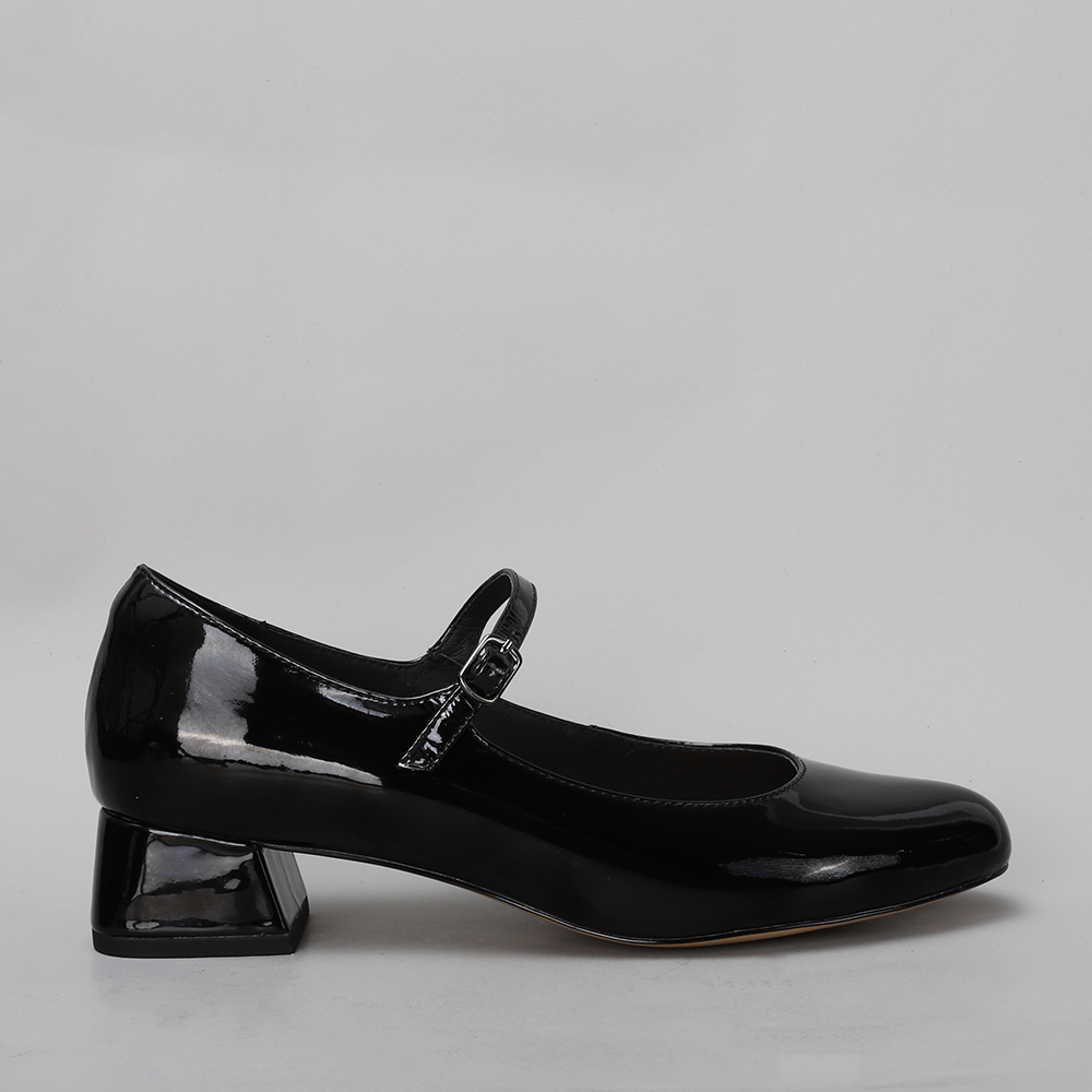 Black patent Naked Arches sandal with sleek strap design and chunky heel, showcasing stylish footwear by Naked Arches.
