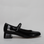 Black patent Naked Arches sandal with sleek strap design and chunky heel, showcasing stylish footwear by Naked Arches.