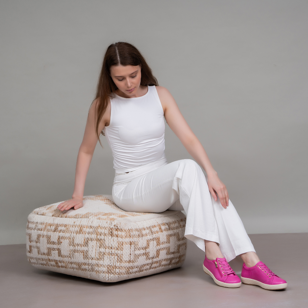 Naked Arches Alia hot pink sneakers with sleek design and white sole, showcasing vibrant color and modern style.