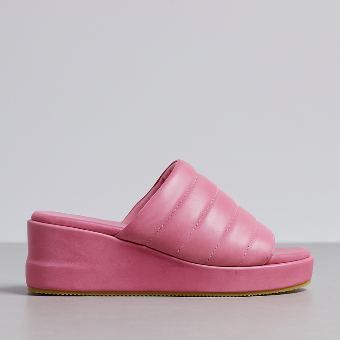 Le Sansa Lesansa Mazz Fuchsia slip-on shoes with a vibrant pink color and casual design, displayed on a white background.