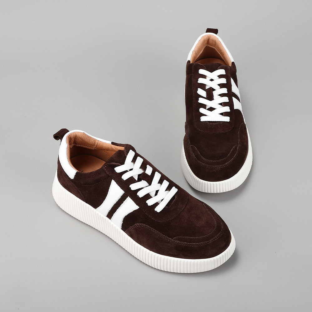 Le Sansa Comet Chocolate suede sneakers with white laces and rubber sole, showcasing stylish casual footwear.