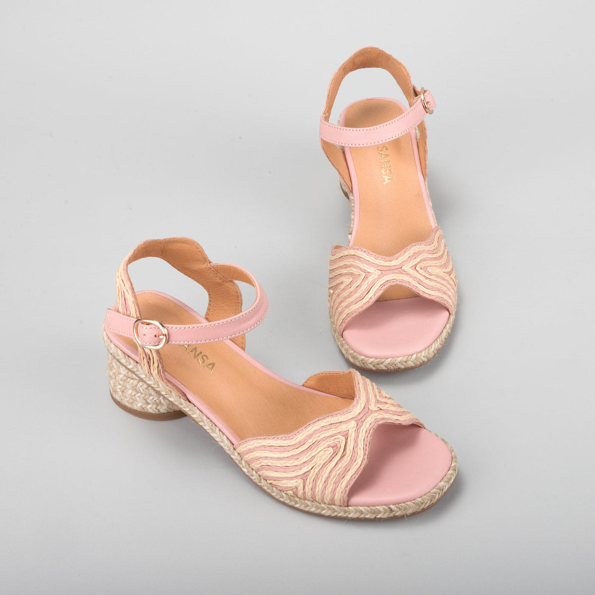 Le Sansa Alys baby pink and beige sandals with soft straps and bow detail, perfect for little feet.