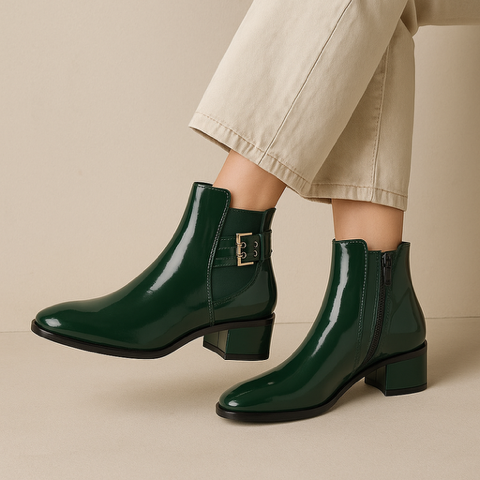 Le Sansa Romy green boots with stylish design, featuring a sleek silhouette and vibrant green color.