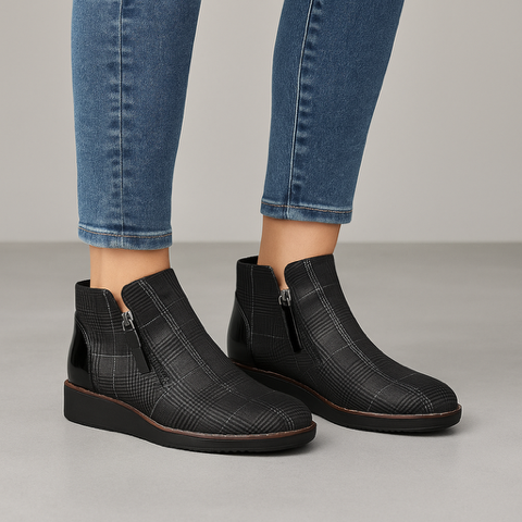 Le Sansa Ronnie Black ankle boots with stylish design, featuring sleek black leather and modern silhouette.