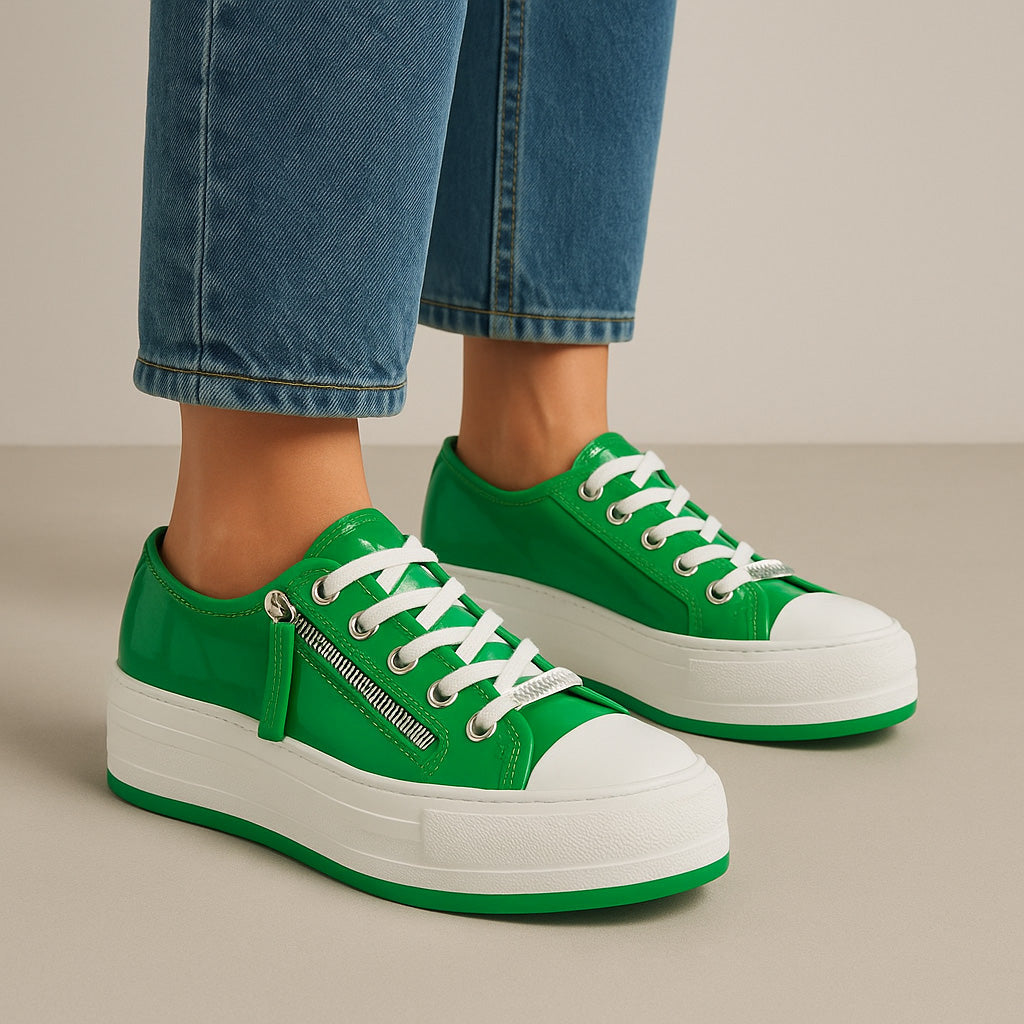 Django & Juliette Giza emerald patent sneakers with green shiny finish and stylish design, shown in a lifestyle setting.