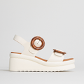 EOS Menorcas Bone sandals featuring a white platform design with open toes and ankle straps, stylish and comfortable for casual wear.