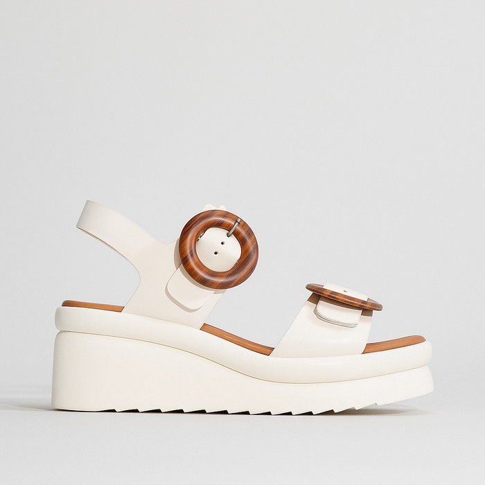 EOS Menorcas Bone sandals with white platform design, featuring open toes and ankle strap for casual summer wear.