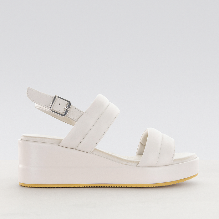 Le Sansa silver grey sandal with a white platform sole, stylish open-toe design, and ankle strap for a casual, chic look.