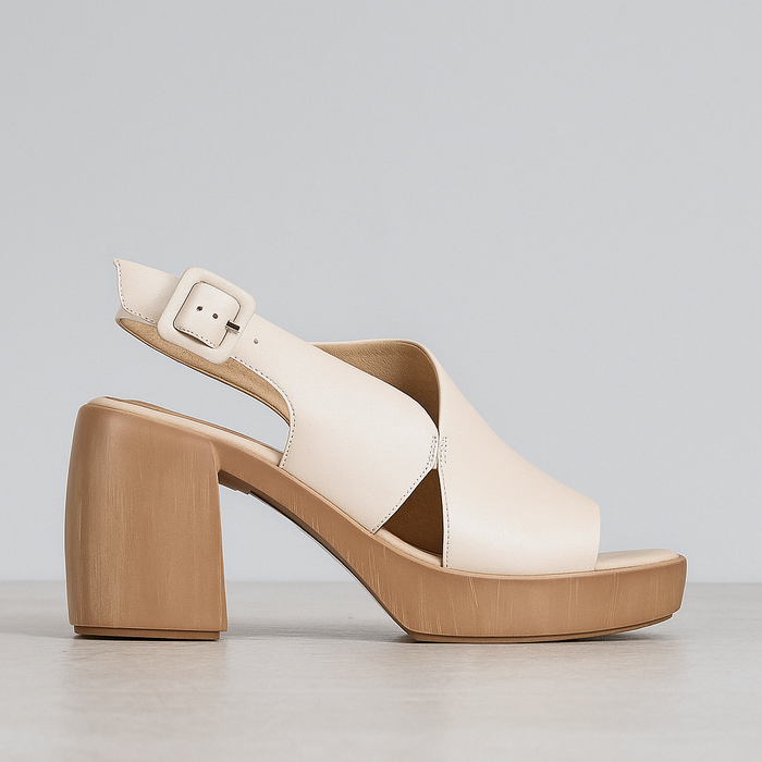 Eos Spicer Brich stylish heeled sandals with open toes and ankle straps, featuring a sleek design and neutral color.