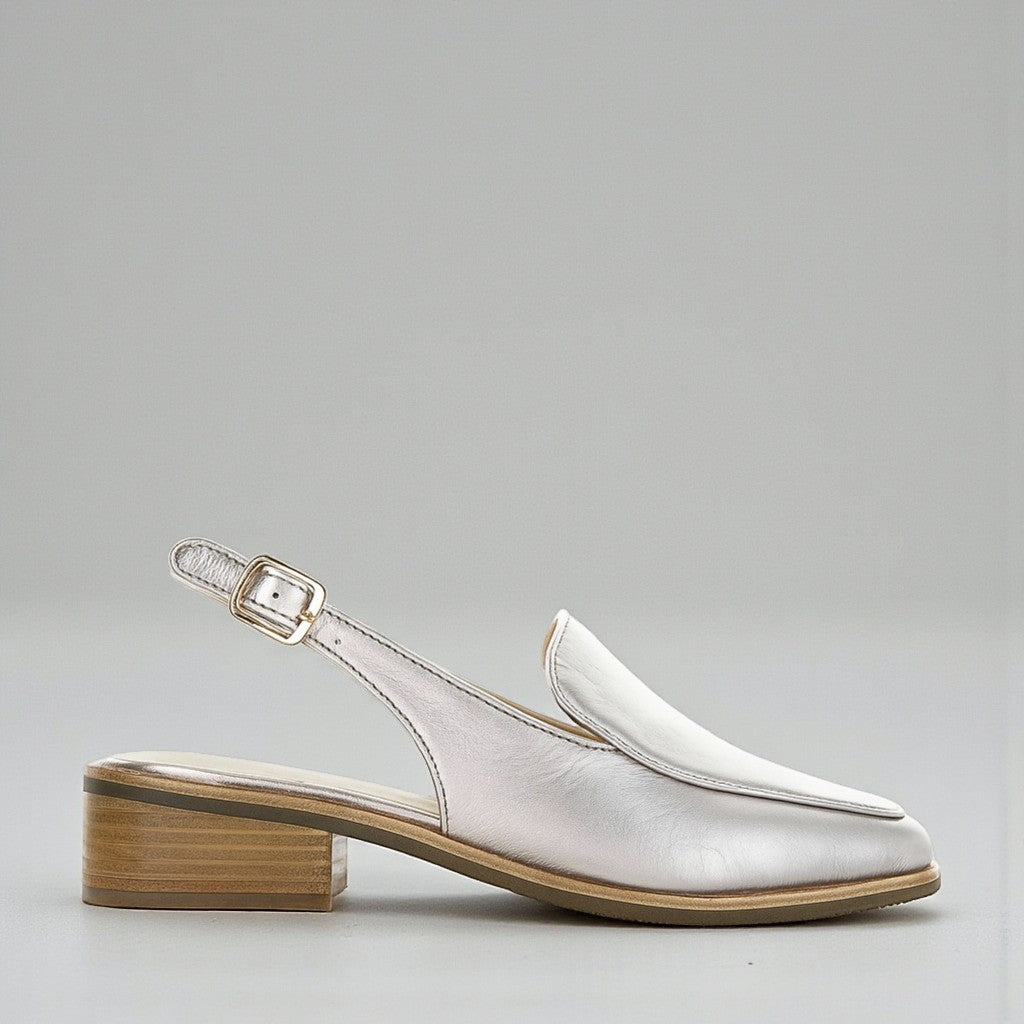Le Sansa Danter Champagne sandals displayed on a stylish shoe display, featuring elegant strappy design and neutral champagne color.