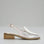Le Sansa Danter Champagne sandals displayed on a stylish shoe display, featuring elegant strappy design and neutral champagne color.