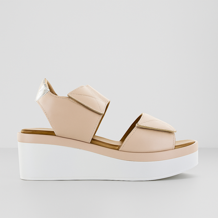 Beige wedge sandal from Le Sansa Tristen Cameo collection featuring stylish straps and comfortable design.