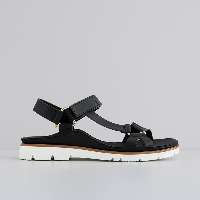 Black VS Treads Yakka sandals displayed on a neutral background, featuring open-toe design and adjustable straps.