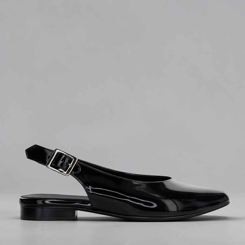 NAKED ARCHES Zodiac black patent sandals with sleek strap design, stylish and elegant footwear for casual or dressy occasions.