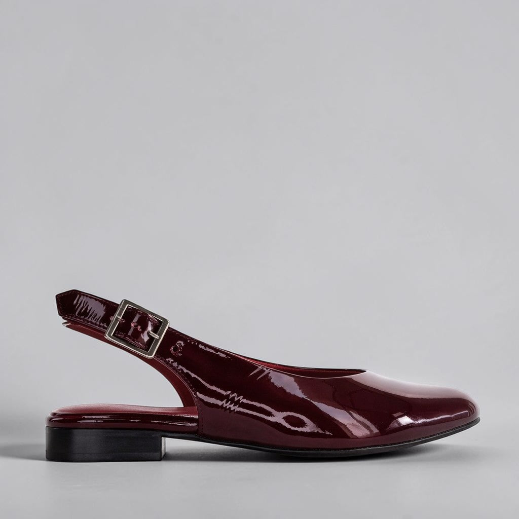 Naked Arches Zodiac Merlot sandals with cushioned footbed and strappy design, showcasing a deep merlot color and stylish comfort.
