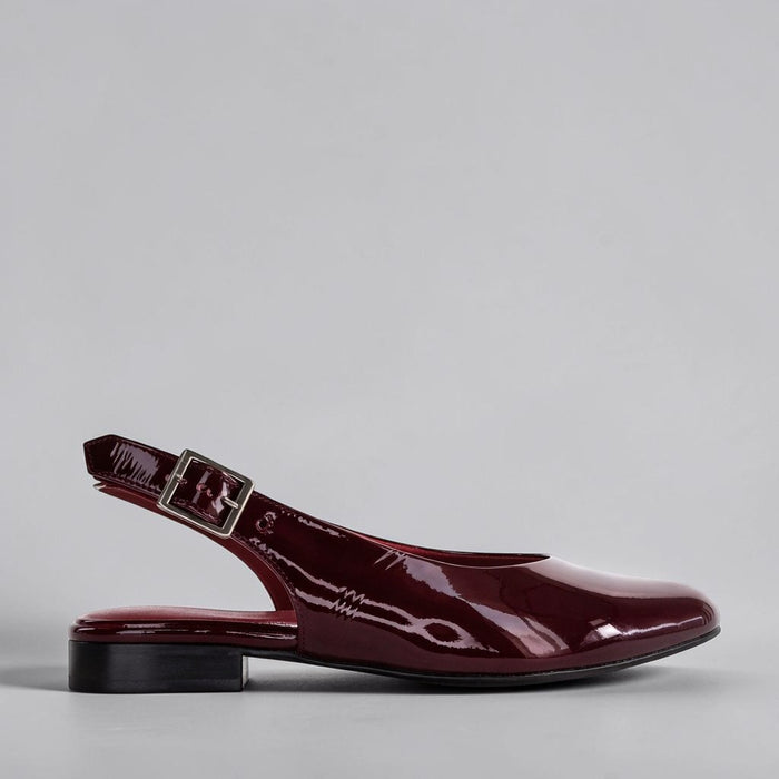 Naked Arches Zodiac Merlot sandals with strappy design and flat sole, featuring zodiac-inspired leather straps in merlot color.