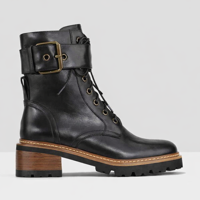 Black EOS Line boots by Eos featuring sleek design and sturdy sole, shown from a side view.