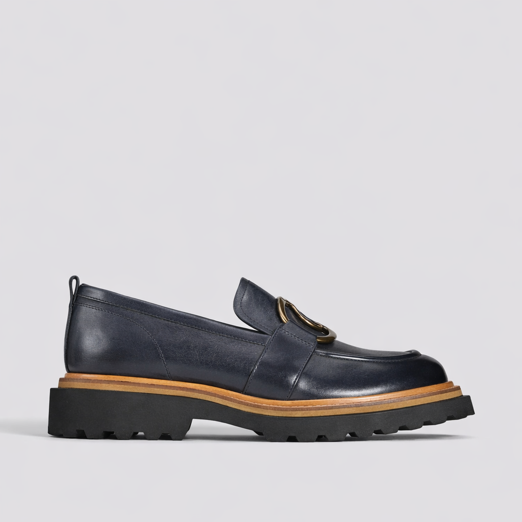 EOS ABBI navy loafers featuring sleek design and comfortable fit, shown on a grey background.