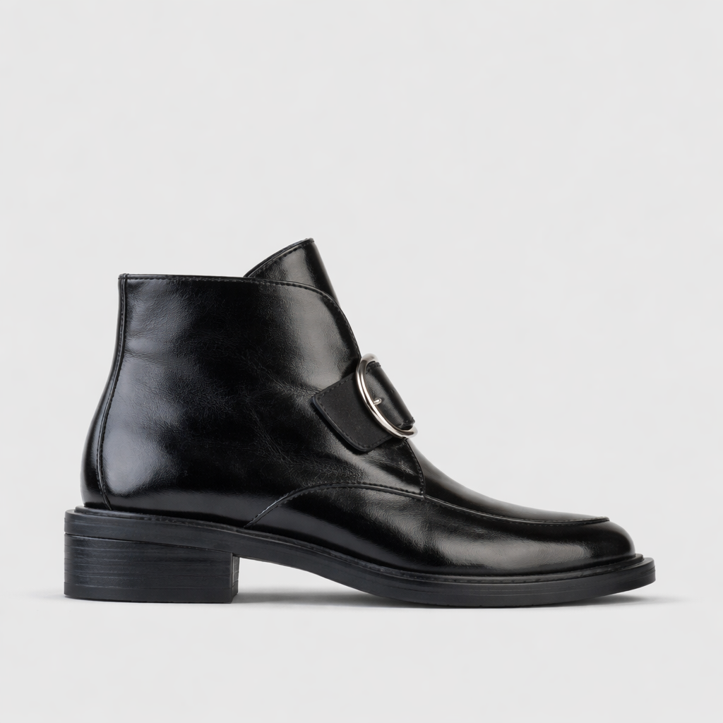 Eos Coine Black Boots with sleek black leather design, stylish ankle height, and minimalistic details.