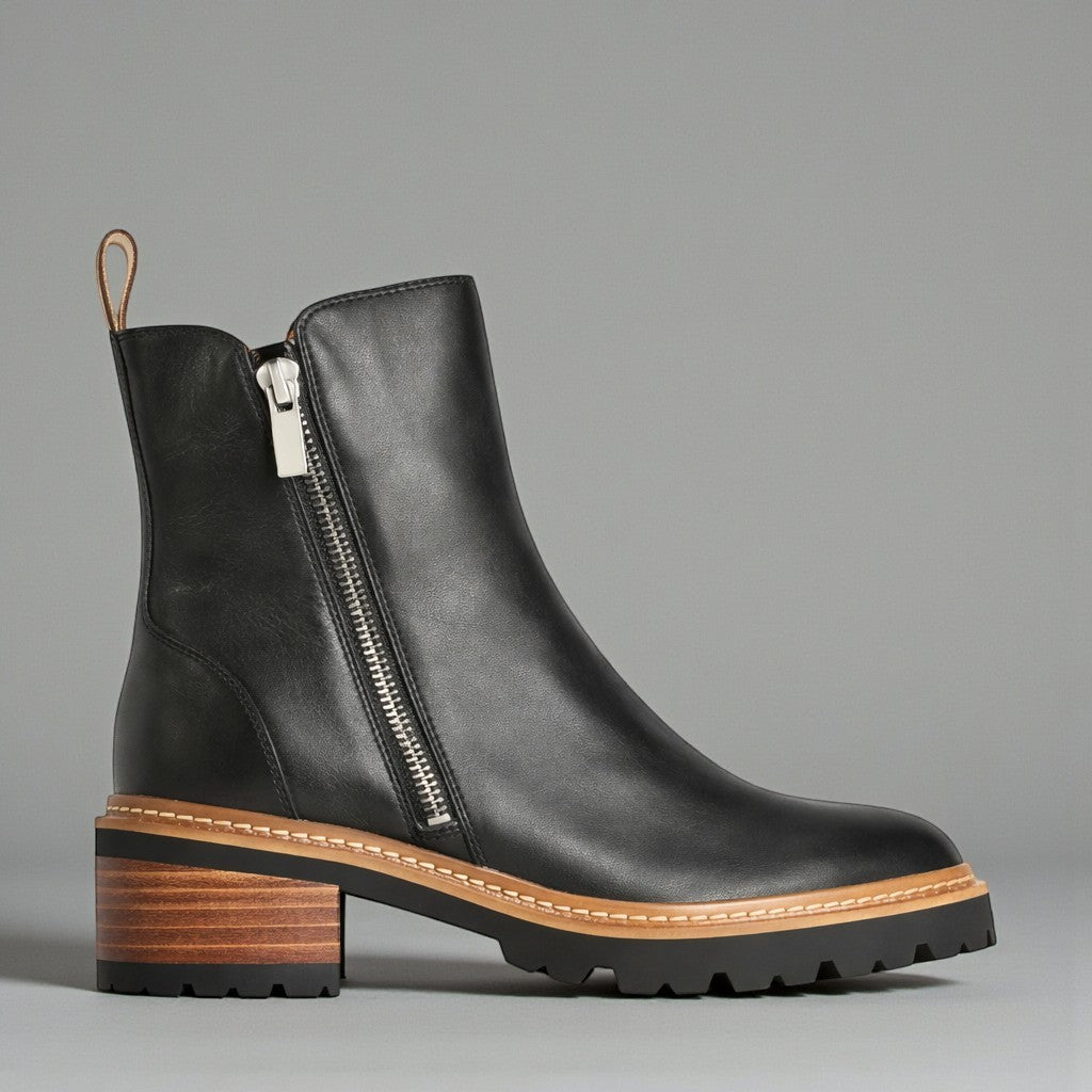 Black EOS Lindira boots with sleek design and ankle-high style, featuring a smooth leather finish and modern silhouette.