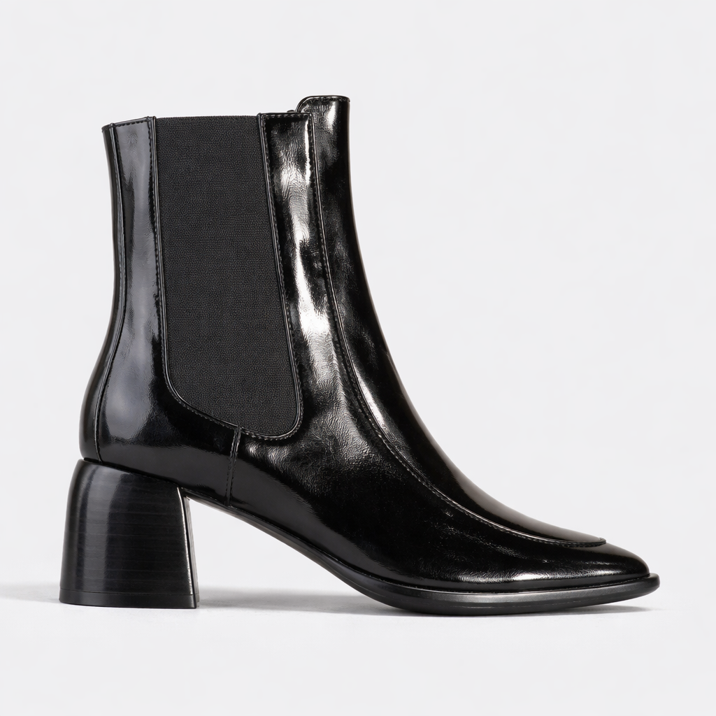 Black EOS Charcoal Boots with sleek design, featuring laces and sturdy soles, ideal for stylish casual or outdoor wear.