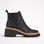 Black Los Cabos Vittoria boots with a sleek design, shown on a grey background, featuring stylish ankle-height footwear.