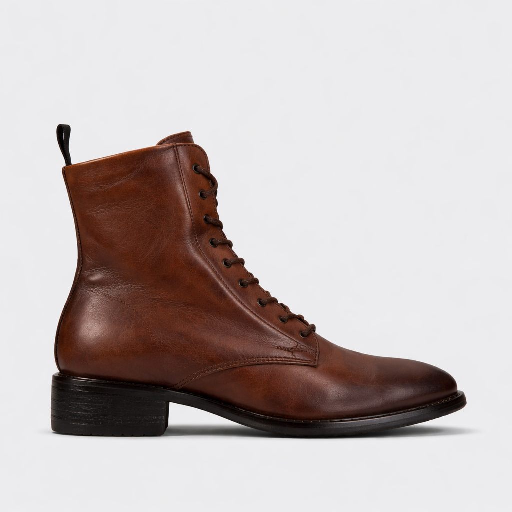 EOS Celia Brandy boots featuring ankle-length design, smooth leather finish, and stylish stitching details.