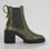 LE SANSA Samira olive boots with ankle-high design, featuring a sleek silhouette and stylish laces, perfect for casual wear.