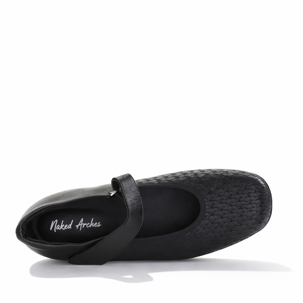 Black casual sneakers from Naked Arches Yaser collection, featuring sleek design and comfortable style.