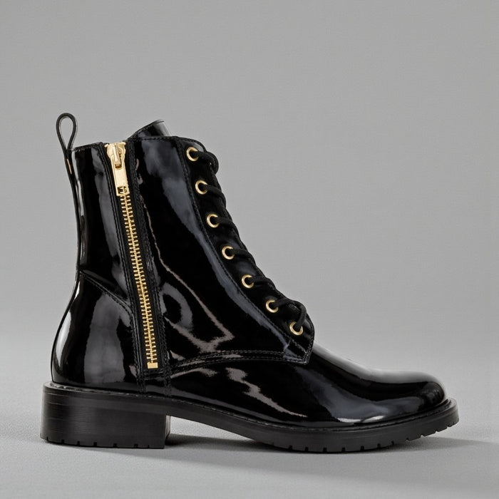 Le Sansa Black Patent Boots with sleek, shiny finish and pointed toes, stylish and modern footwear for fashionable looks.