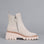 Los Cabos Vianne stone-colored boots with a stylish ankle design, displayed on a neutral grey background.