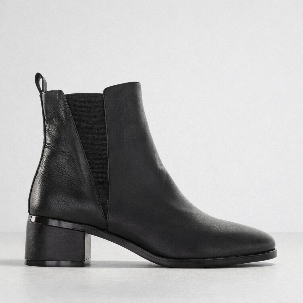 Black LE SANSA Sansa Ring Boots with sleek leather design and ankle-high style, featuring minimalistic aesthetic and sturdy sole.