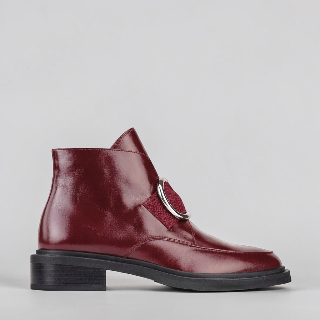 EOS COINE WINE boots in black leather with lace-up design and chunky heel, displayed on a plain background.